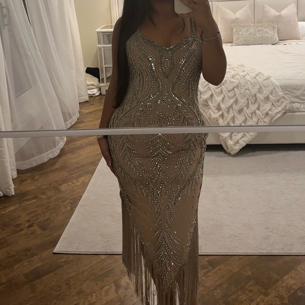 Formal silver beaded and stones dress with silver beaded tassels on bottom.